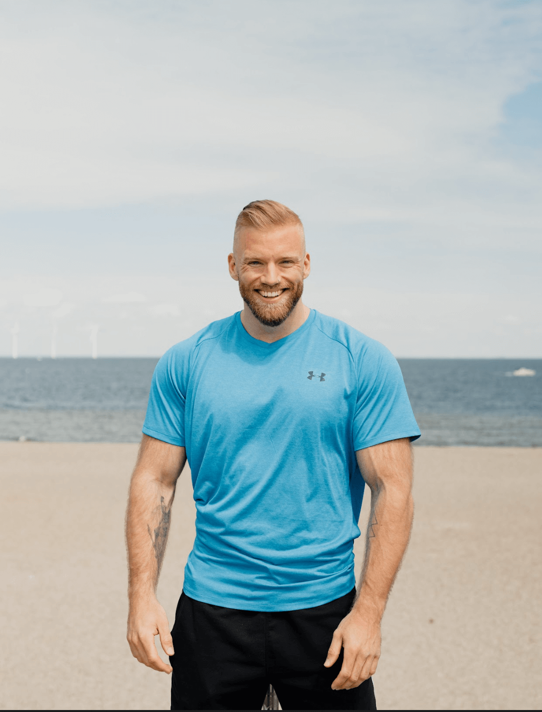 Bork in blue t-shirt looking into the camera